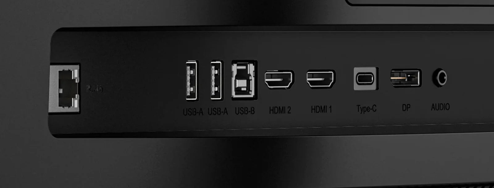 Close-up of the monitor’s input panel, with each port labeled: USB-A, USB-A, USB-B, HDMI 2, HDMI 1, Type-C, DP and audio